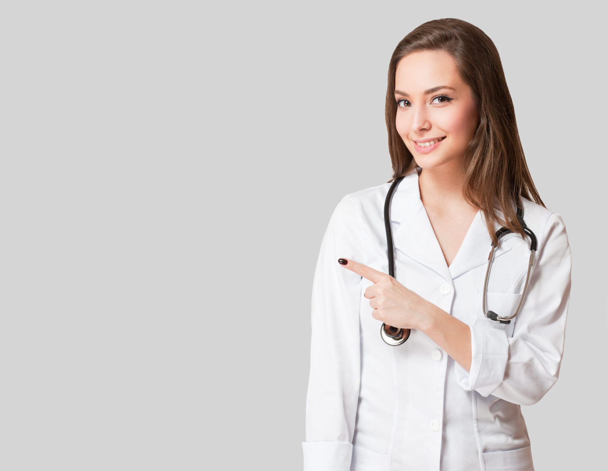 Portrait of a young female doctor in white coat.